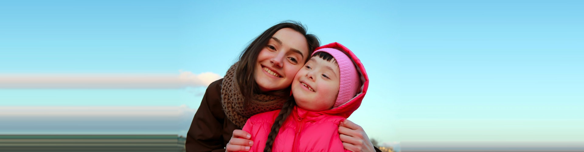 young girl with autism with caregiver concept